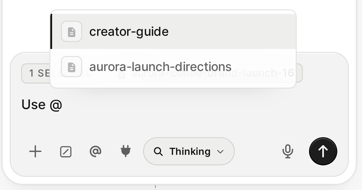 Typing @ in Agent opens a real picker for creator-guide and aurora-launch-directions notes, while an image remains selected.