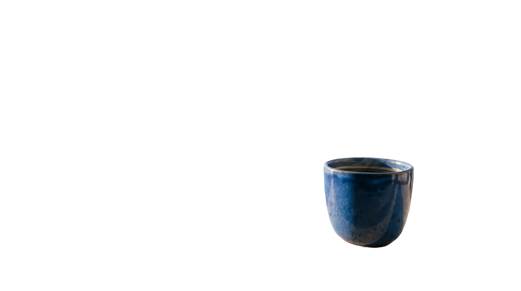 The same blue cup isolated on transparency, in its original position and framing. The stone, window and sea are removed.